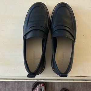 Everlane, black leather loafers with rubber soles.